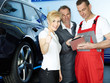 Customer in garage shows thumbs up for good service