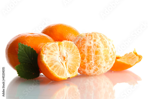Photo: Ripe tasty tangerines isolated on white Ripe tasty tangerines isolated on white