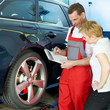 Car mechanic and customer look at the repair costs
