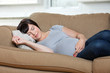 Pregnant Woman Sleeping On Sofa
