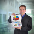 Photo: Business Man Holding Graph Chart Business Man Holding Graph Chart