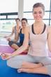 Happy women sitting in easy yoga pose