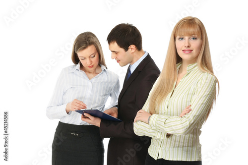 Photo: Portrait of business people, focus on a businesswoman Portrait of business people, focus on a businesswoman