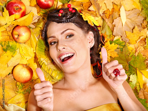 Photo: Woman holding autumn fruit. Woman holding autumn fruit.