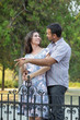Photo: Young smiling couple in a park Young smiling couple in a park