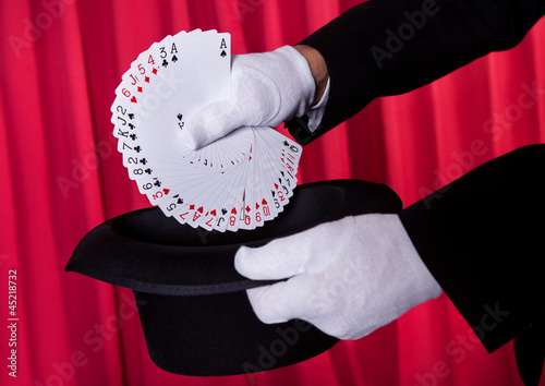 Photo: Magician Hand Holding Fanned Deck Of Cards Magician Hand Holding Fanned Deck Of Cards