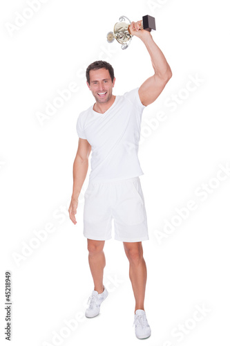 Photo: Portrait Of Young Man Holding Trophy Portrait Of Young Man Holding Trophy