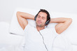 Young Man Listening Music On Headphone