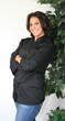 Happy confident female chef in uniform