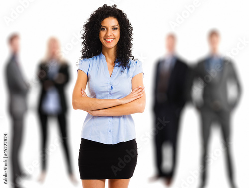 Photo: Businesswoman in front of her team Businesswoman in front of her team
