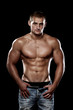 Muscular guy posing in studio
