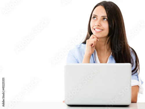 Photo: Pensive woman with a laptop Pensive woman with a laptop