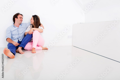 Photo: Couple in their empty apartment Couple in their empty apartment