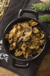 traditional polish sauerkraut (bigos) with mushrooms and plums