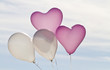 Foto: Four helium filled balloons against the sky Four helium filled balloons against the sky