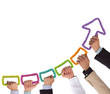 Hands holding colorful rope forming arrow pointing upwards