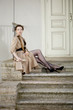 Photo: Woman in a retro style in the city Woman in a retro style in the city