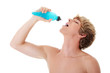 Young athletic man with energy drink after his exercising at gym