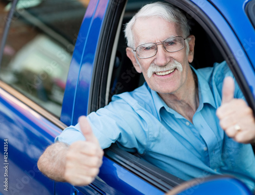 Photo: Man driving a car Man driving a car