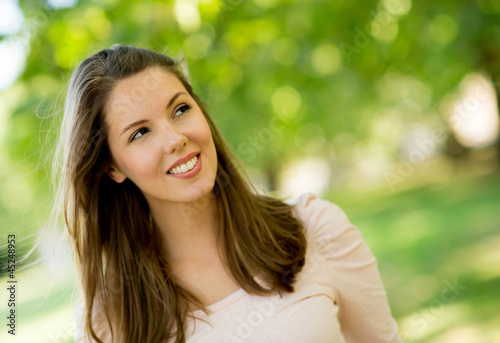 Photo: Thoughtful woman outdoors Thoughtful woman outdoors