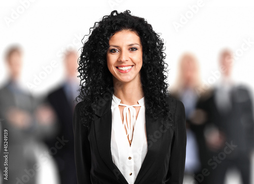 Photo: Beautiful businesswoman in front of her team Beautiful businesswoman in front of her team