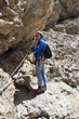 female hiker on via ferrata