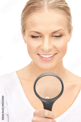 Photo: woman with magnifying glass woman with magnifying glass