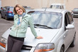 Photo: Pretty Caucasain girl standing behind a new own car Pretty Caucasain girl standing behind a new own car