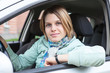 Photo: Joyful blond hair woman sitting in land vehicle Joyful blond hair woman sitting in land vehicle