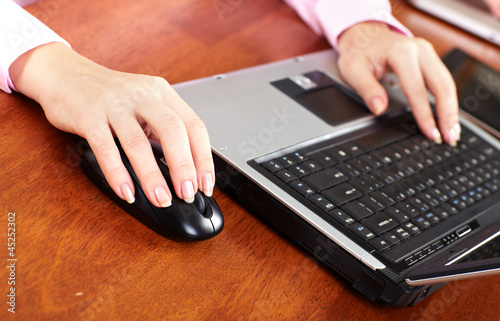 Photo: Hand with a computer mouse. Hand with a computer mouse.