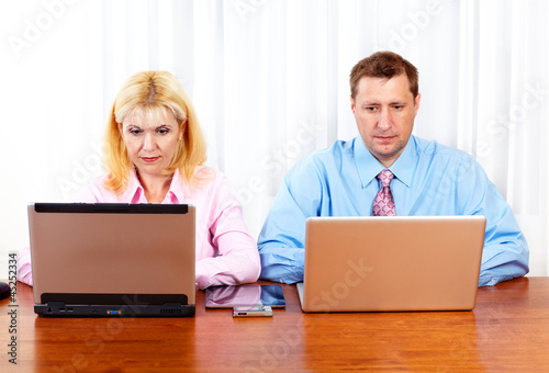 Photo: Business people group working with laptop. Business people group working with laptop.