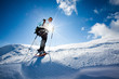 Hiker in winter mountains snowshoeing