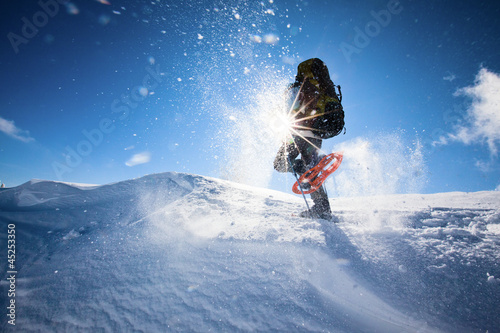 Photo: Hiker in winter mountains snowshoeing Hiker in winter mountains snowshoeing