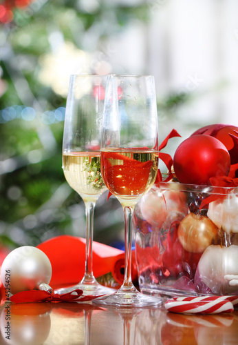 Photo: Glasses of champagne and Christmas decorations Glasses of champagne and Christmas decorations