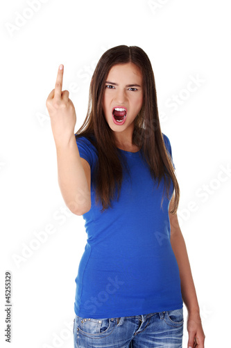 Photo: Teen girl with middle finger up Teen girl with middle finger up