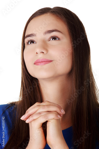 Photo: Young caucasian woman praying Young caucasian woman praying