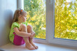 Sad girl in the window