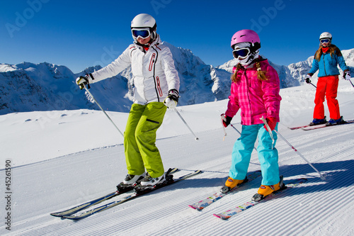 Photo: Skiing, winter, ski lesson - skiers on mountainside Skiing, winter, ski lesson - skiers on mountainside