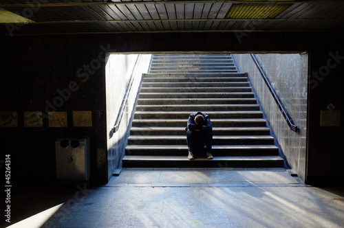 Photo: Lonely man sitting on the stairs Lonely man sitting on the stairs