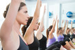 Aerobic Pilates personal trainer in a gym group class