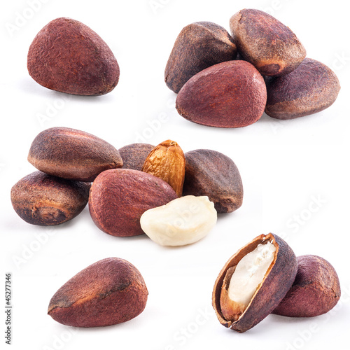 Photo: Collection of Pine nuts isolated on white background Collection of Pine nuts isolated on white background