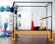 Pilates aerobic instructor woman in cadillac