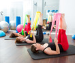 Photo: Aerobics pilates women with rubber bands in a row Aerobics pilates women with rubber bands in a row