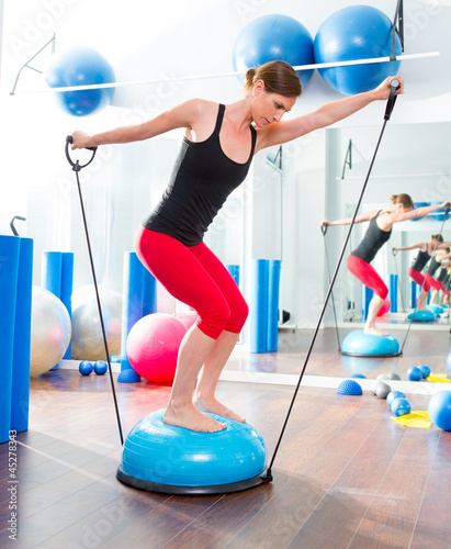 Photo: Bosu ball for fitness instructor woman in aerobics Bosu ball for fitness instructor woman in aerobics