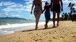 Family go for a walking along sand beach