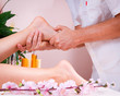 female foot massage at the spa