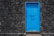 Blue door lava stone masonry wall at La Palma