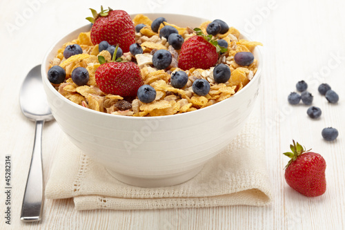 Photo: Bowl of healthy muesli and fresh berries Bowl of healthy muesli and fresh berries
