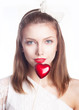 Beautiful smiling girl, red heart shape symbol - valentine s day