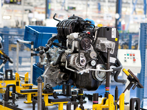 Photo: car engine assembled on the factory production line car engine assembled on the factory production line